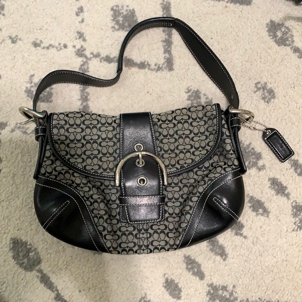 Black Coach purse with buckle.
